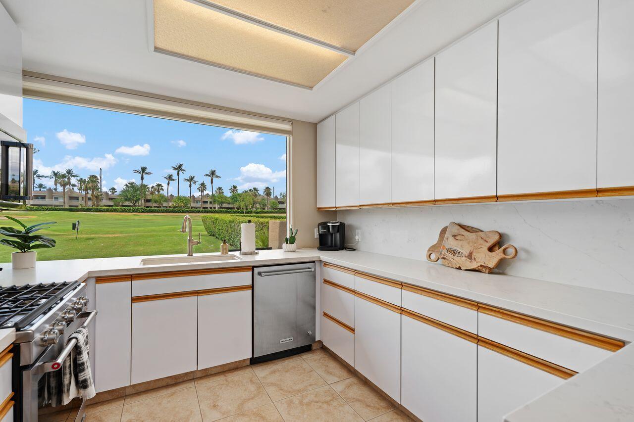 20 Pebble Beach Drive Rancho Mirage, CA 92270 - Photo 16 of 41 a kitchen with a sink and cabinets