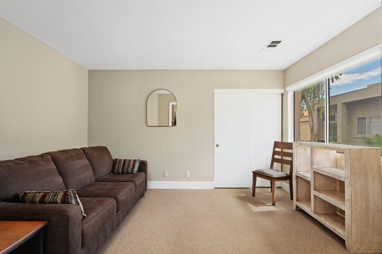 20 Pebble Beach Drive Rancho Mirage, CA 92270 - Photo 18 of 41 a living room with furniture and a fireplace