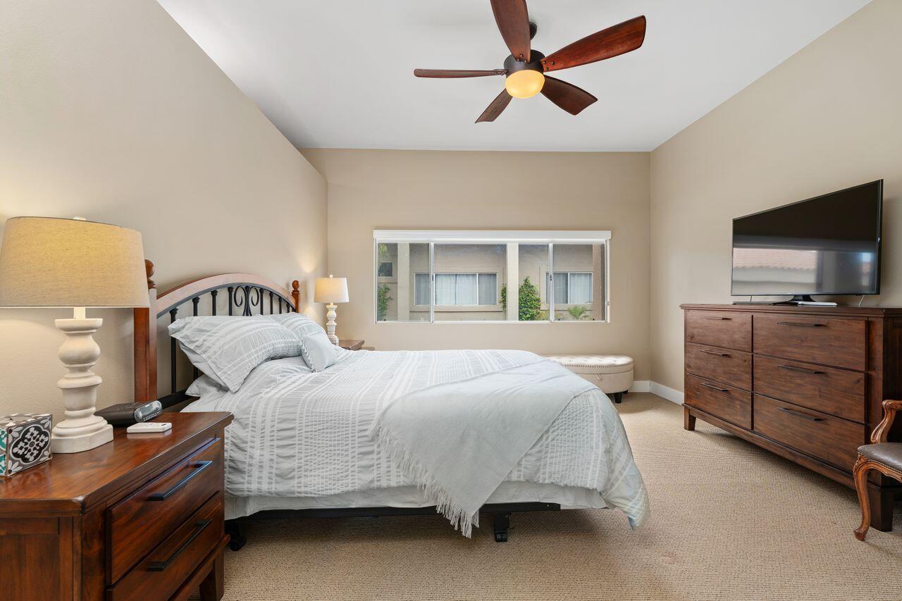 20 Pebble Beach Drive Rancho Mirage, CA 92270 - Photo 23 of 41 a bedroom with a bed and a tv