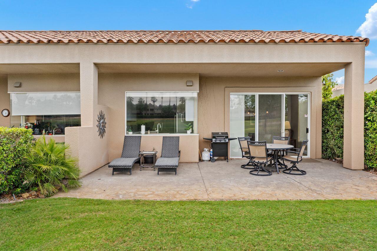 20 Pebble Beach Drive Rancho Mirage, CA 92270 - Photo 28 of 41 a view of a patio with a table and chairs