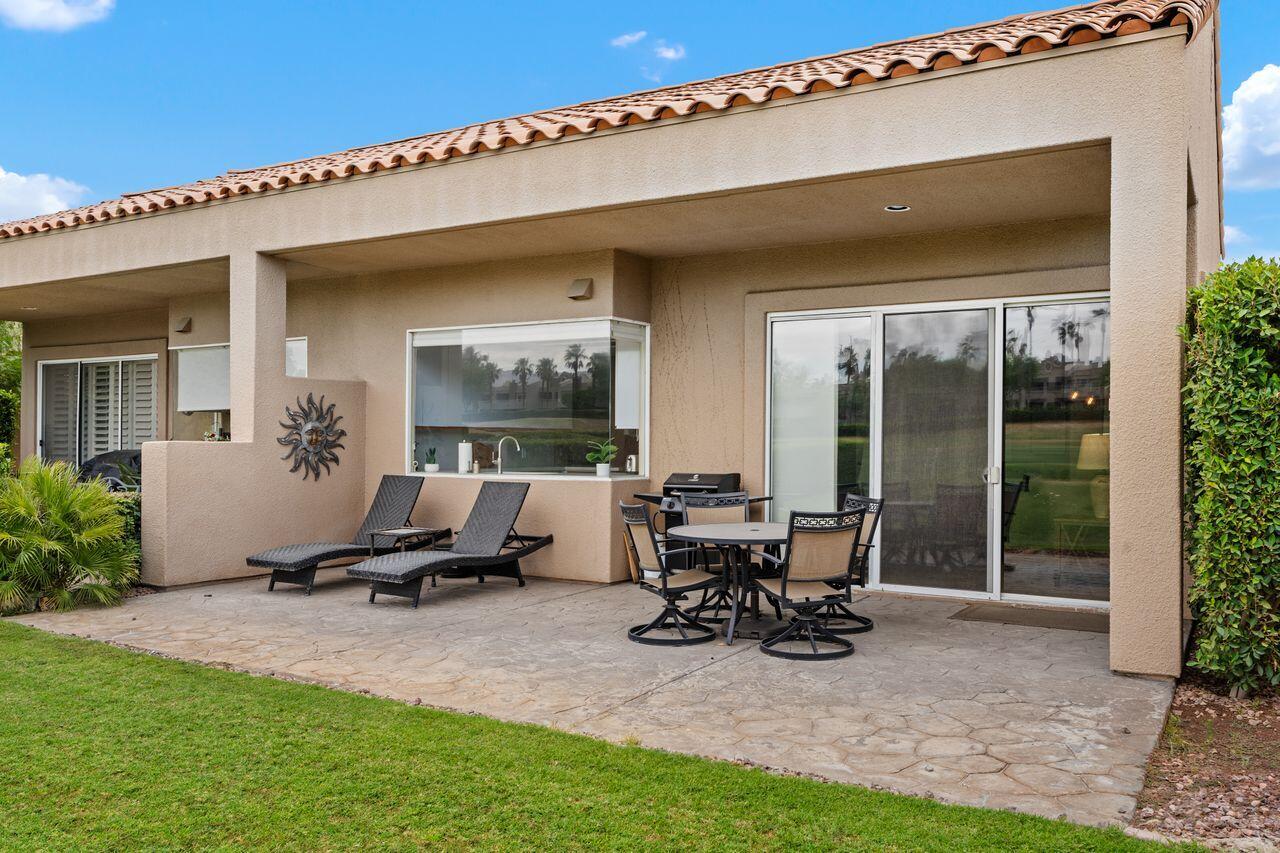 20 Pebble Beach Drive Rancho Mirage, CA 92270 - Photo 29 of 41 a view of a house with backyard sitting area and garden