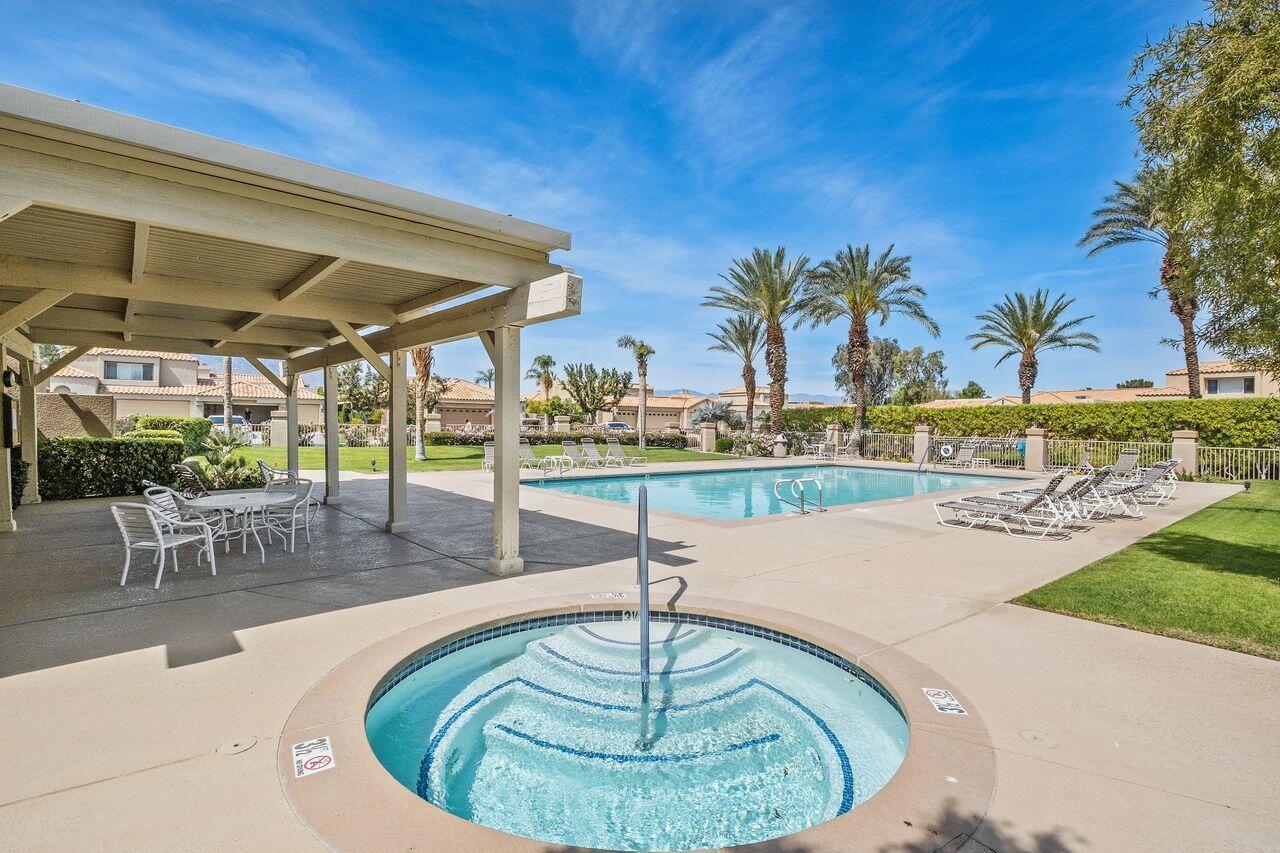 20 Pebble Beach Drive Rancho Mirage, CA 92270 - Photo 40 of 41 a swimming pool with outdoor seating and yard