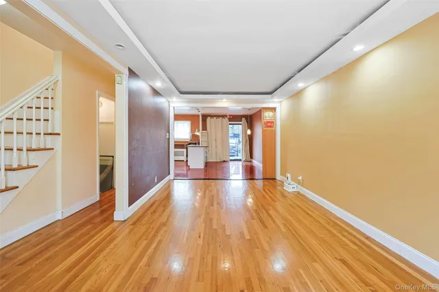 a view of an entryway with wooden floor