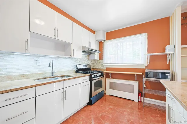 a bathroom with a toilet sink and shower