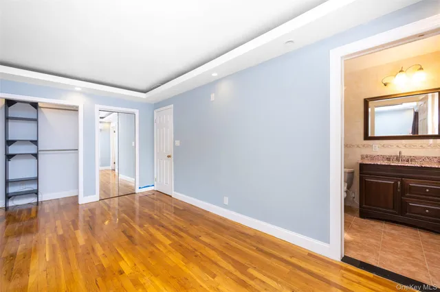 a bathroom with a mirror and a shower