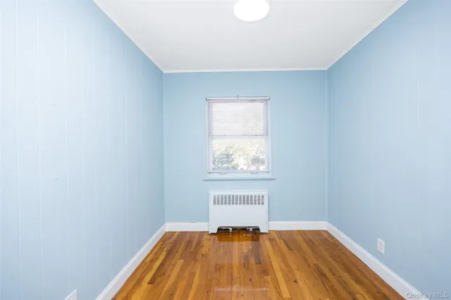 a view of small space with wooden floor