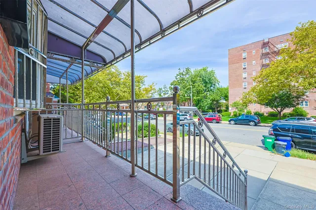a view of a chairs and table in the balcony
