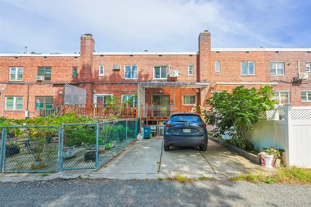 a car parked in front of a house