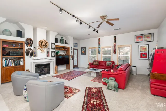 a living room with furniture and a rug