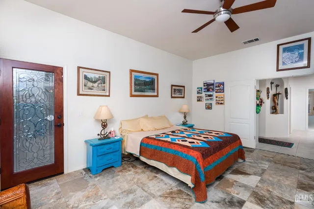 a view of walk in closet with clothes