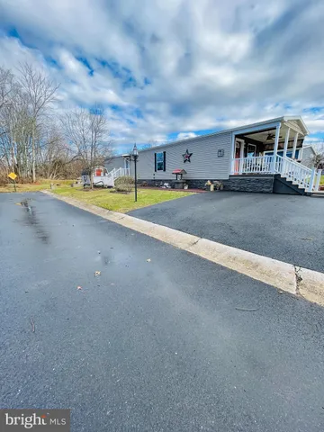 a view of a swimming pool with an outdoor space and seating area