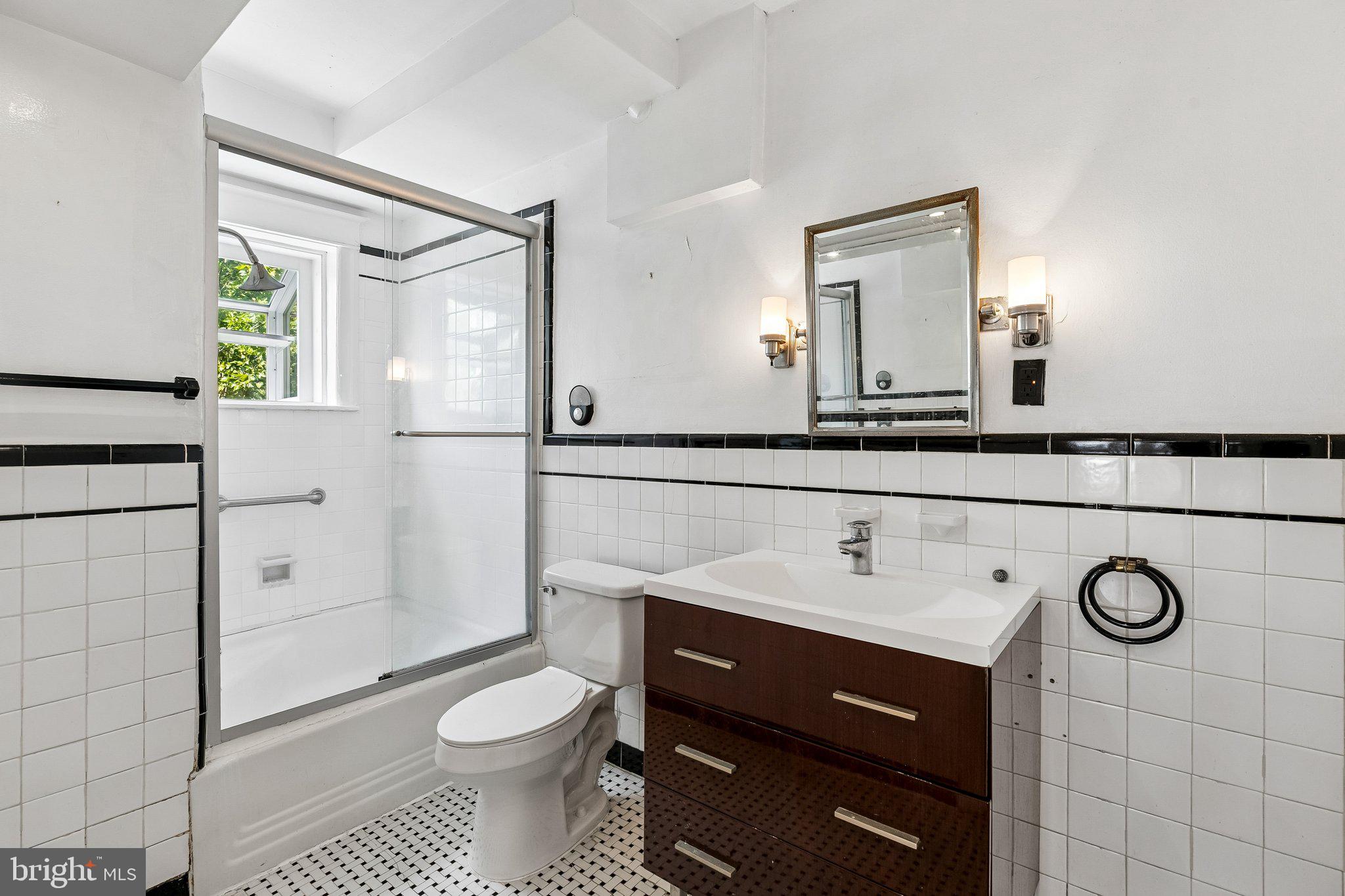 527 South 7th Street, Unit 1 Philadelphia, PA 19147 - Photo 18 of 33 Sleek modern bathroom with classic charm.