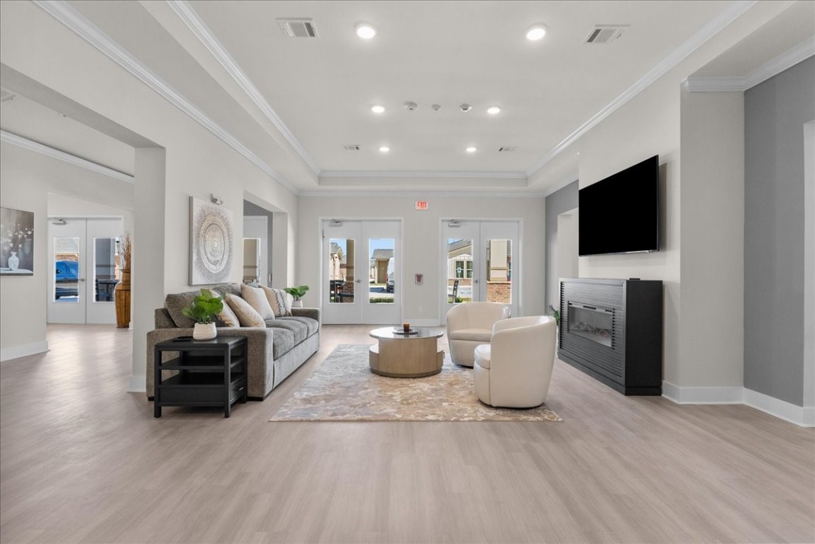 540 Hobbs Road, Unit C1 League City, TX 77573 - Photo 24 of 39 a living room with furniture a flat screen tv and a fireplace
