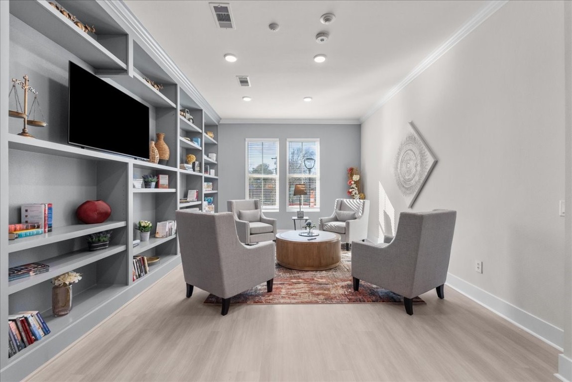 540 Hobbs Road, Unit C1 League City, TX 77573 - Photo 36 of 39 a living room with furniture a flat screen tv and floor to ceiling window