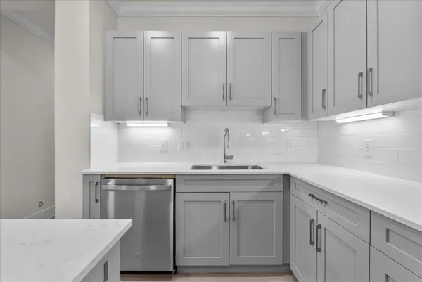 a kitchen with cabinets and white appliances