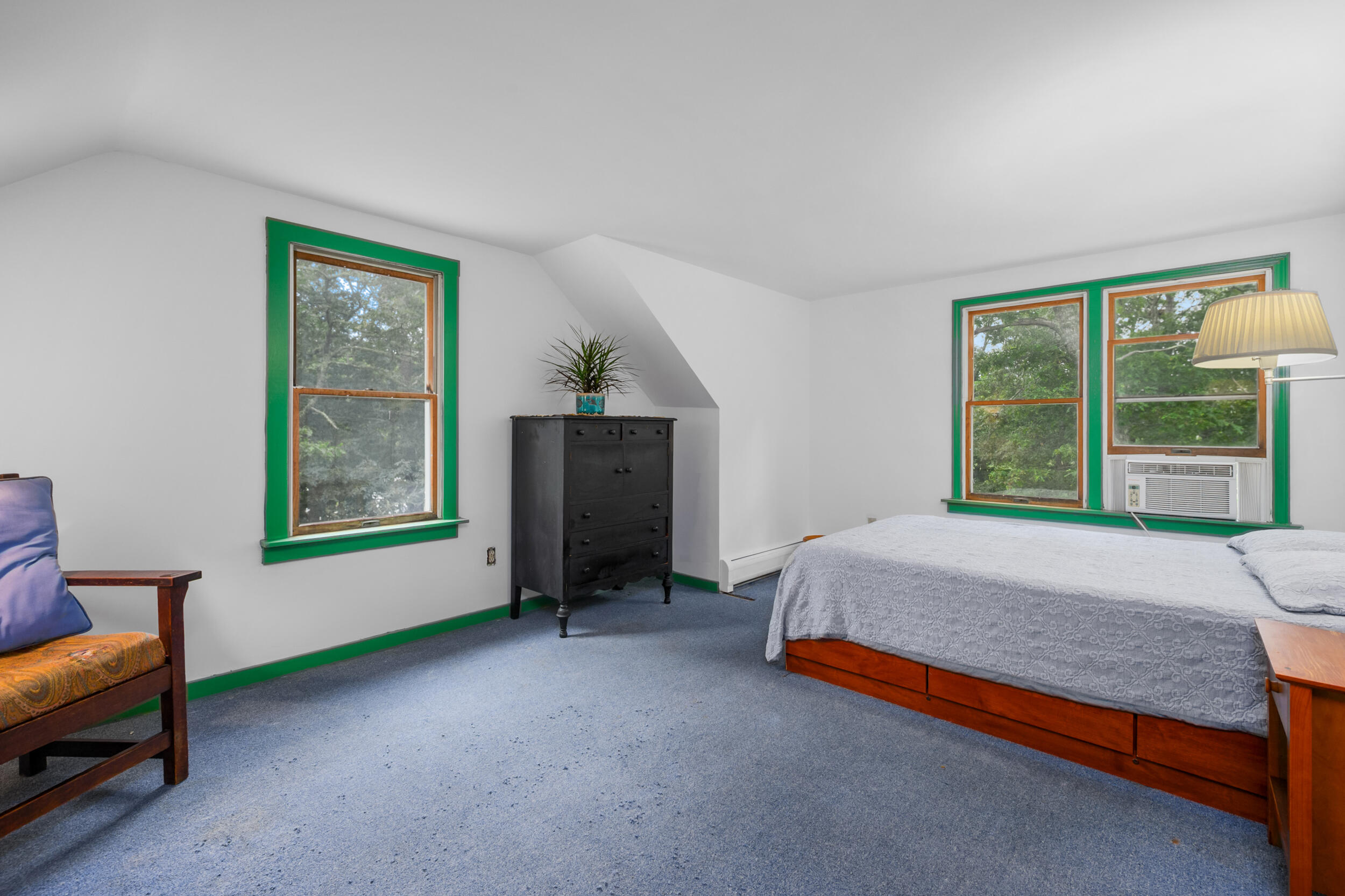 153 Red Fawn Road Brewster, MA 02631 - Photo 22 of 28 a bed sitting in a room with furniture and a window