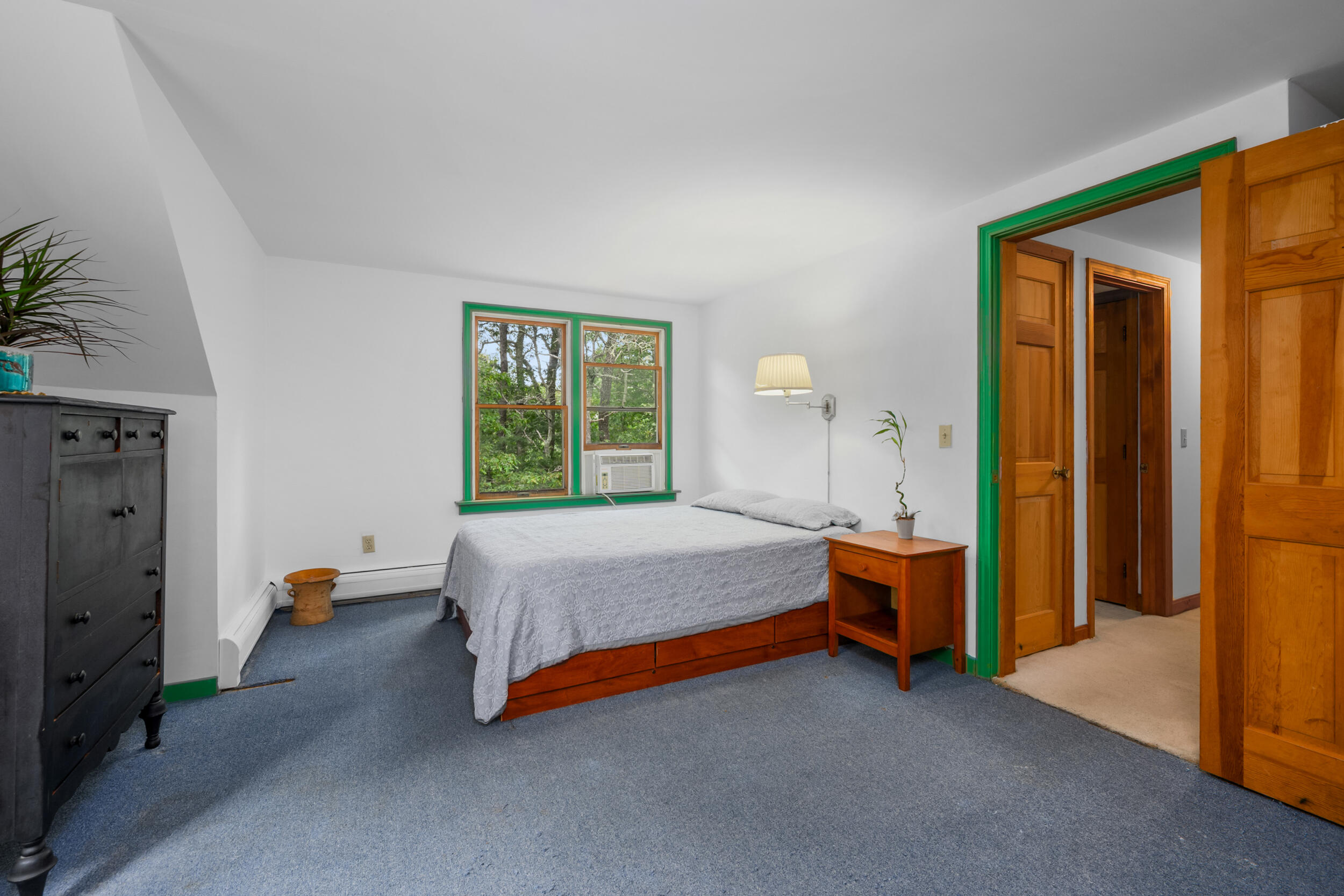 153 Red Fawn Road Brewster, MA 02631 - Photo 23 of 28 a bed room with a bed and a lamp