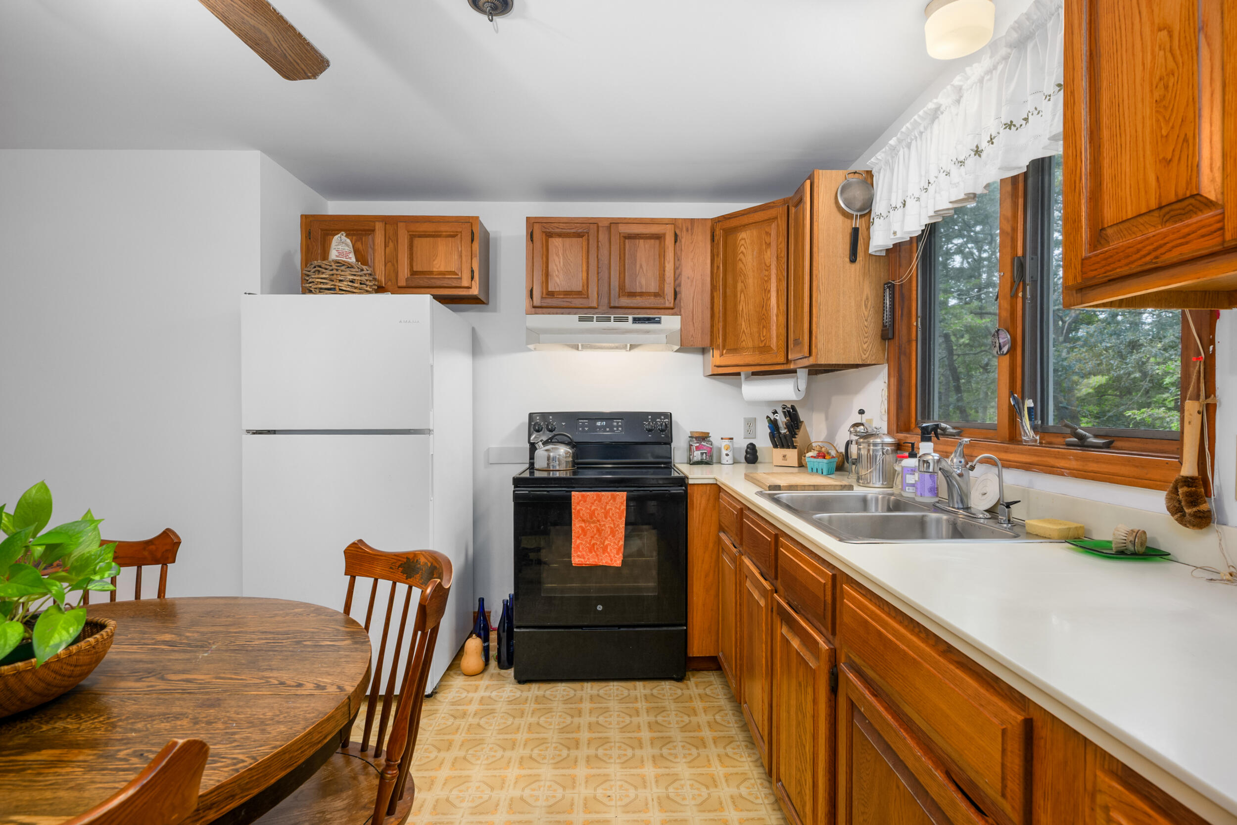 153 Red Fawn Road Brewster, MA 02631 - Photo 10 of 28 a kitchen with a sink and a stove top oven