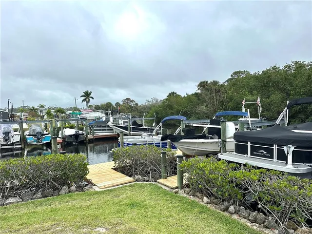 a view of a house with swimming pool and a yard