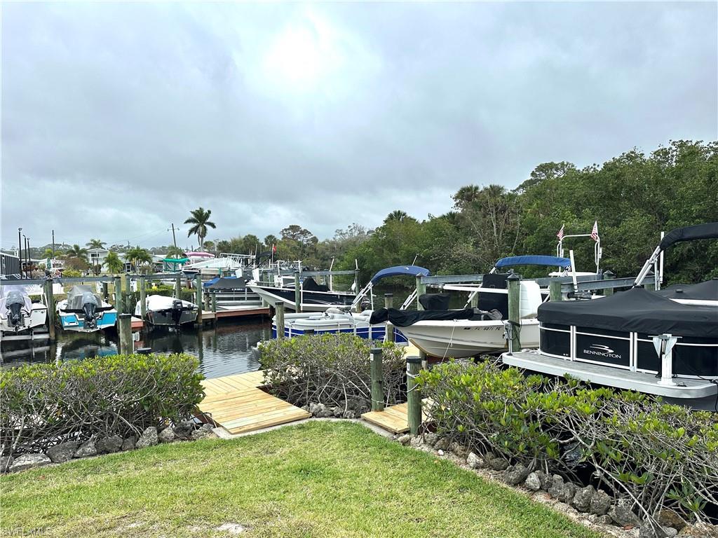 20711 Garden Drive Estero, FL 33928 - Photo 5 of 6 a view of a house with swimming pool and a yard