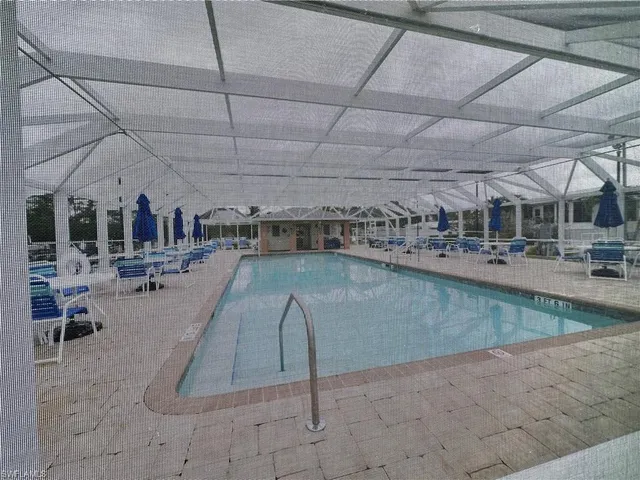 a view of a swimming pool with outdoor space