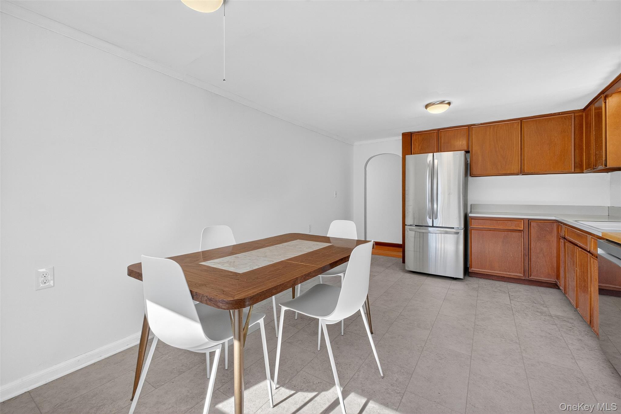 86 Gardnertown Road Newburgh, NY 12550 - Photo 12 of 33 a kitchen with granite countertop a table chairs stove and refrigerator