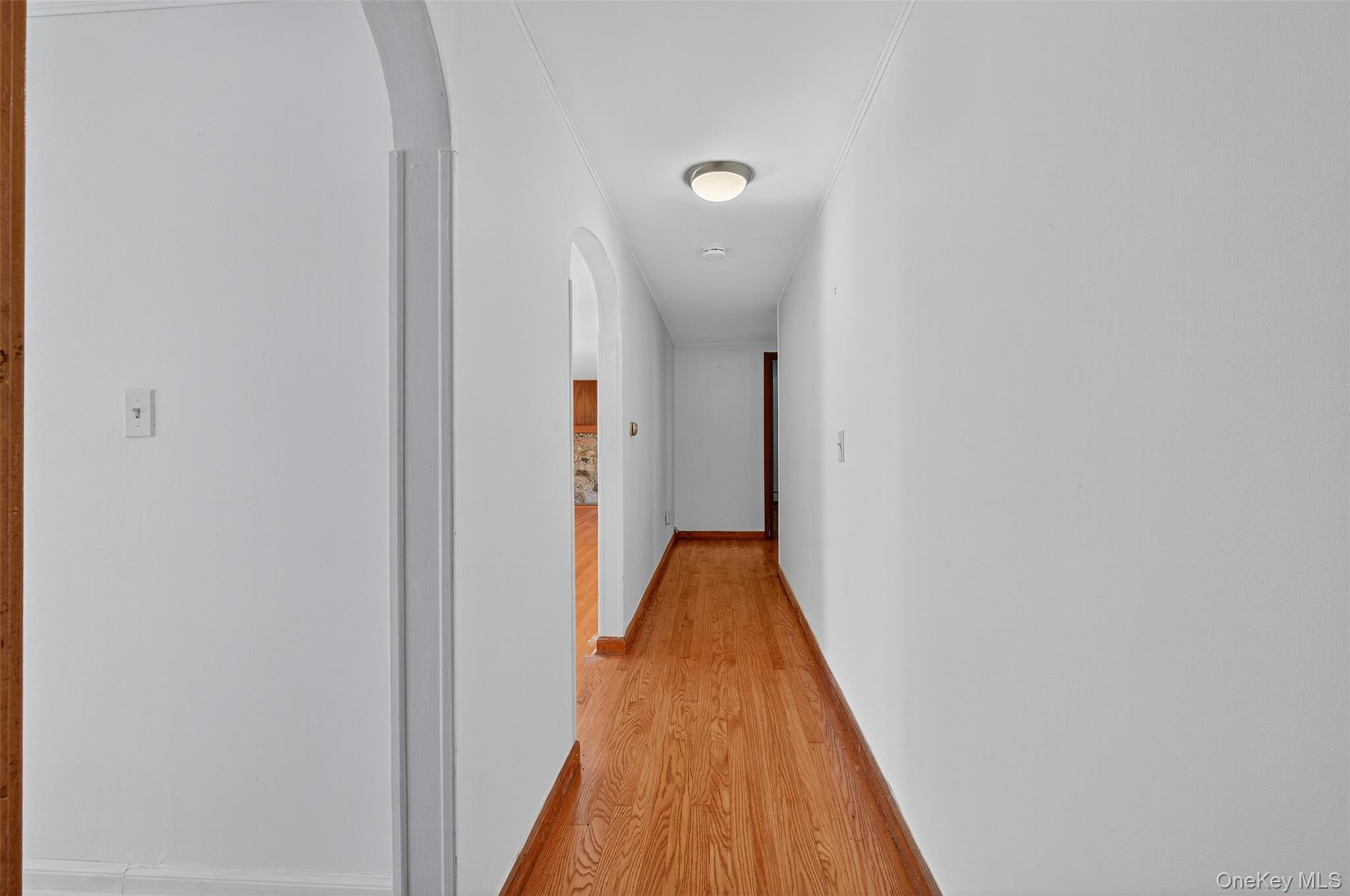 86 Gardnertown Road Newburgh, NY 12550 - Photo 16 of 33 a view of a hallway with wooden floor and closet