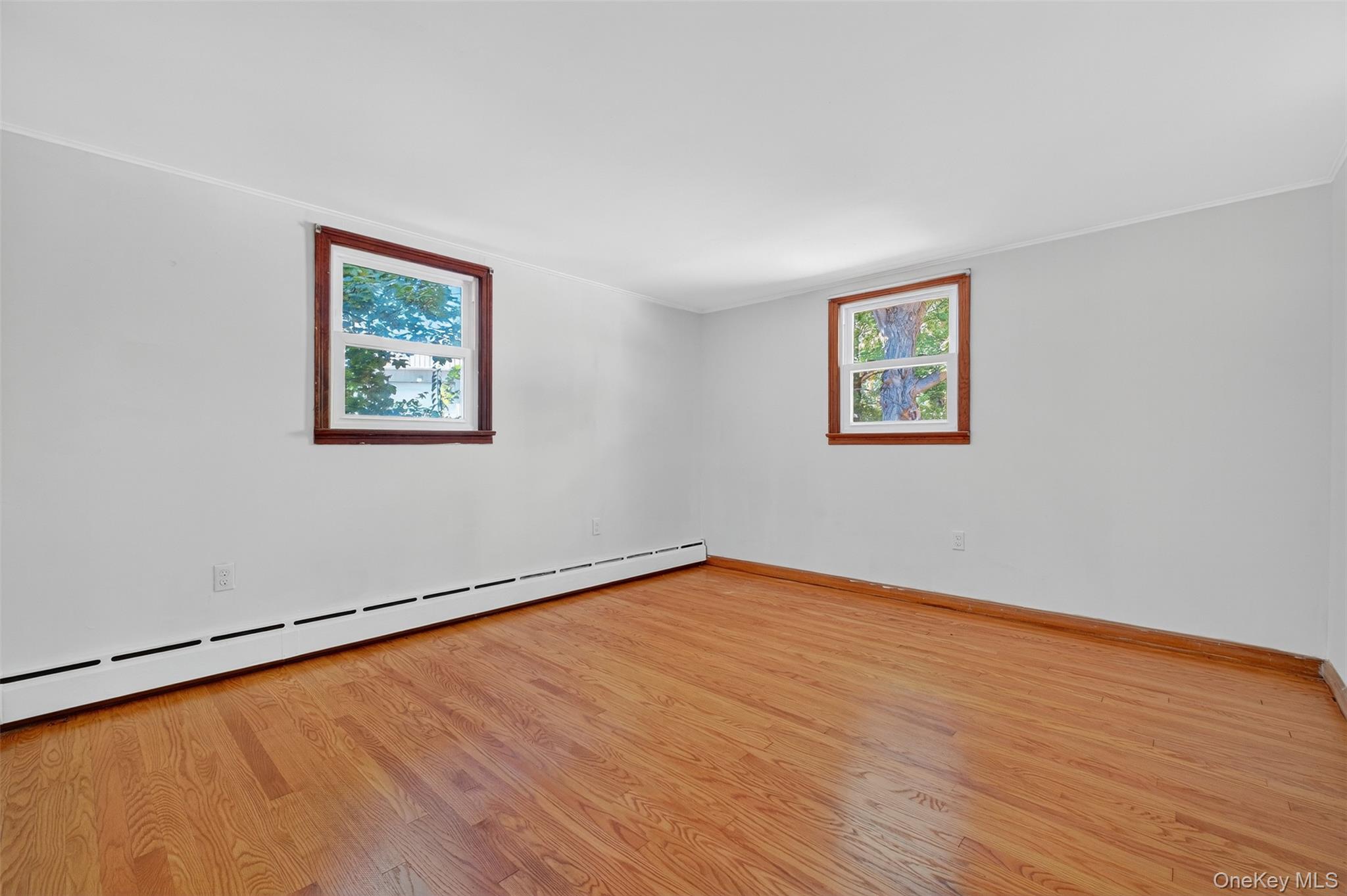 86 Gardnertown Road Newburgh, NY 12550 - Photo 18 of 33 a view of an empty room with wooden floor and a window