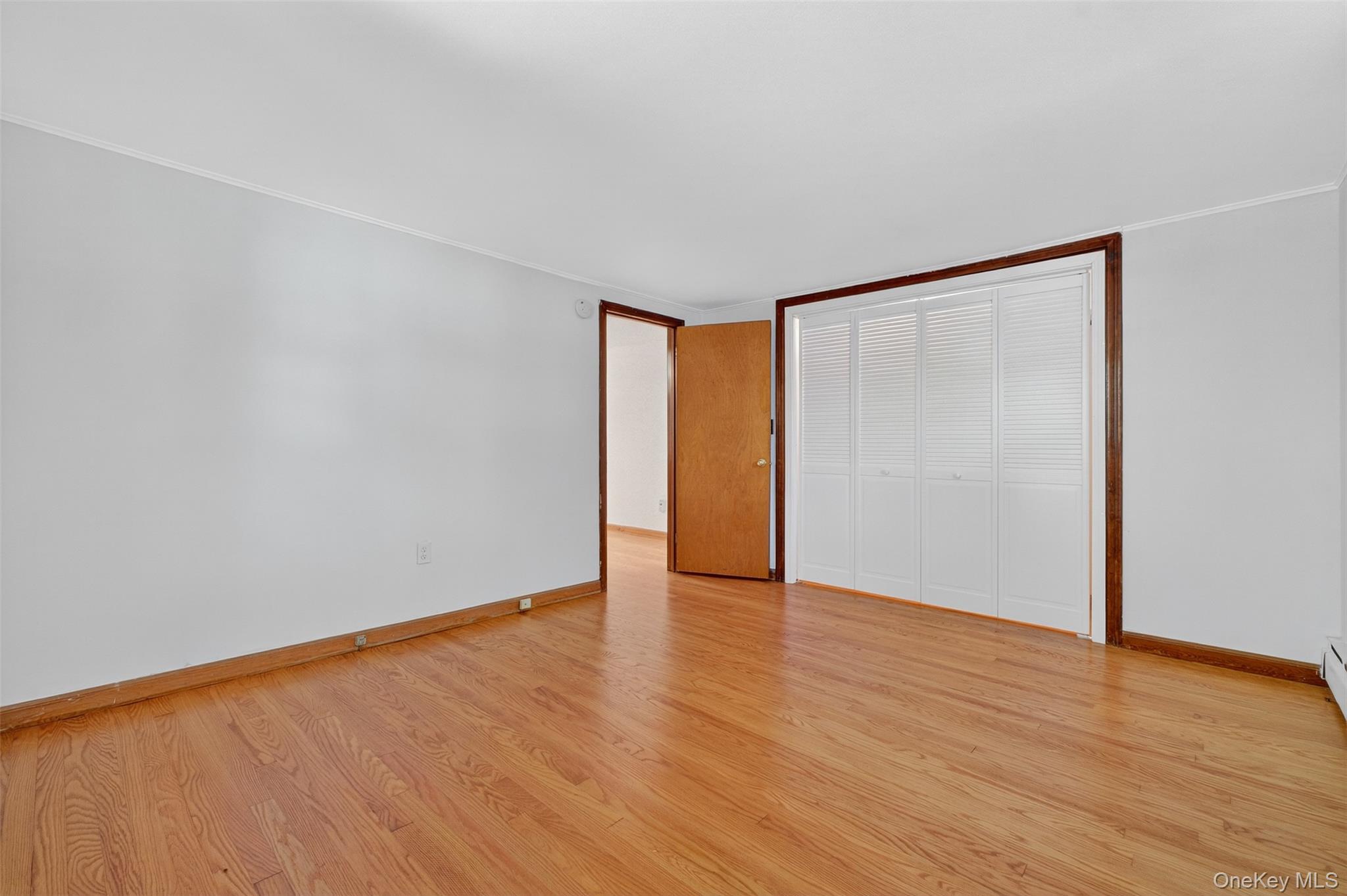 86 Gardnertown Road Newburgh, NY 12550 - Photo 19 of 33 a view of an empty room with wooden floor and a window