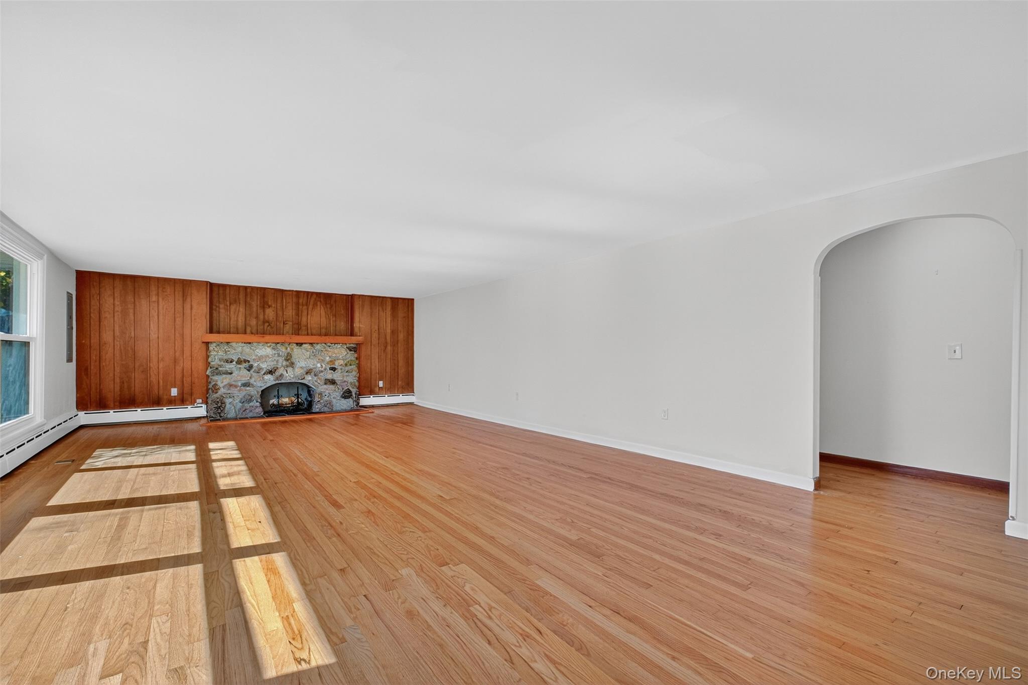 86 Gardnertown Road Newburgh, NY 12550 - Photo 4 of 33 a view of an empty room and wooden floor