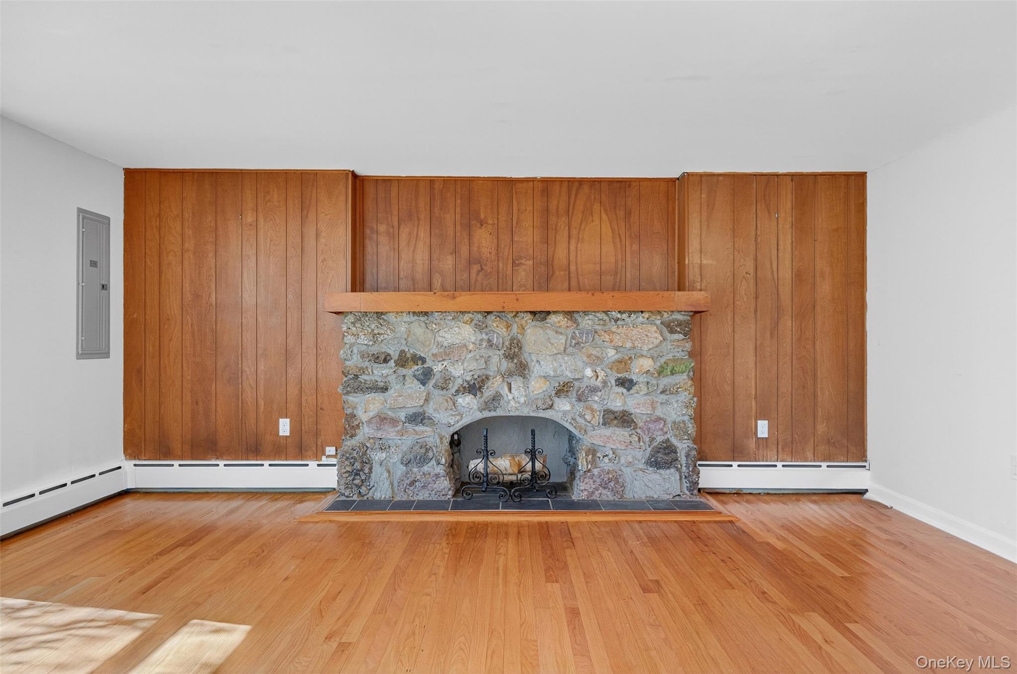 86 Gardnertown Road Newburgh, NY 12550 - Photo 6 of 33 an empty room with a fireplace and painted walls