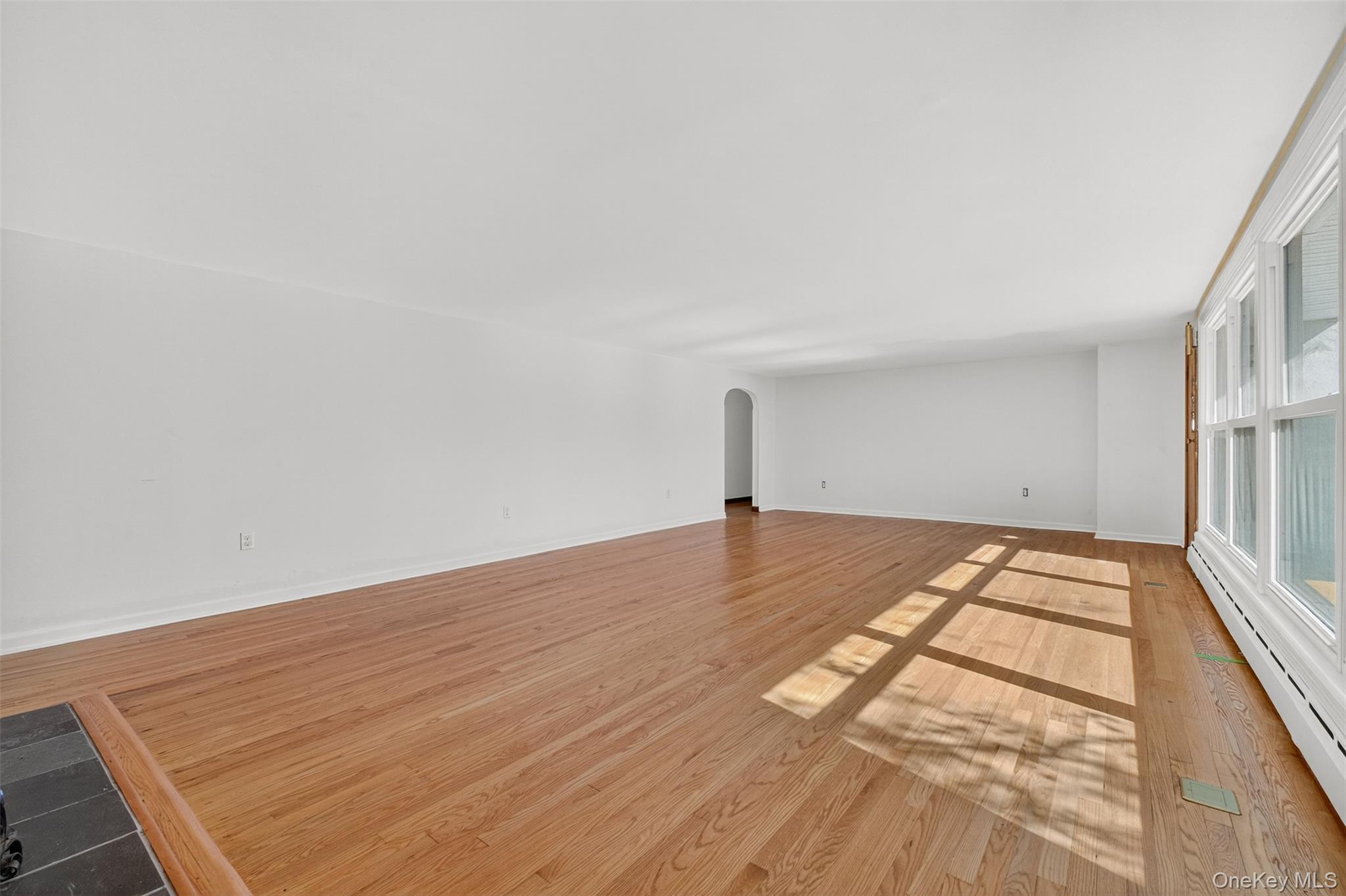 86 Gardnertown Road Newburgh, NY 12550 - Photo 7 of 33 a view of empty room with wooden floor and fan