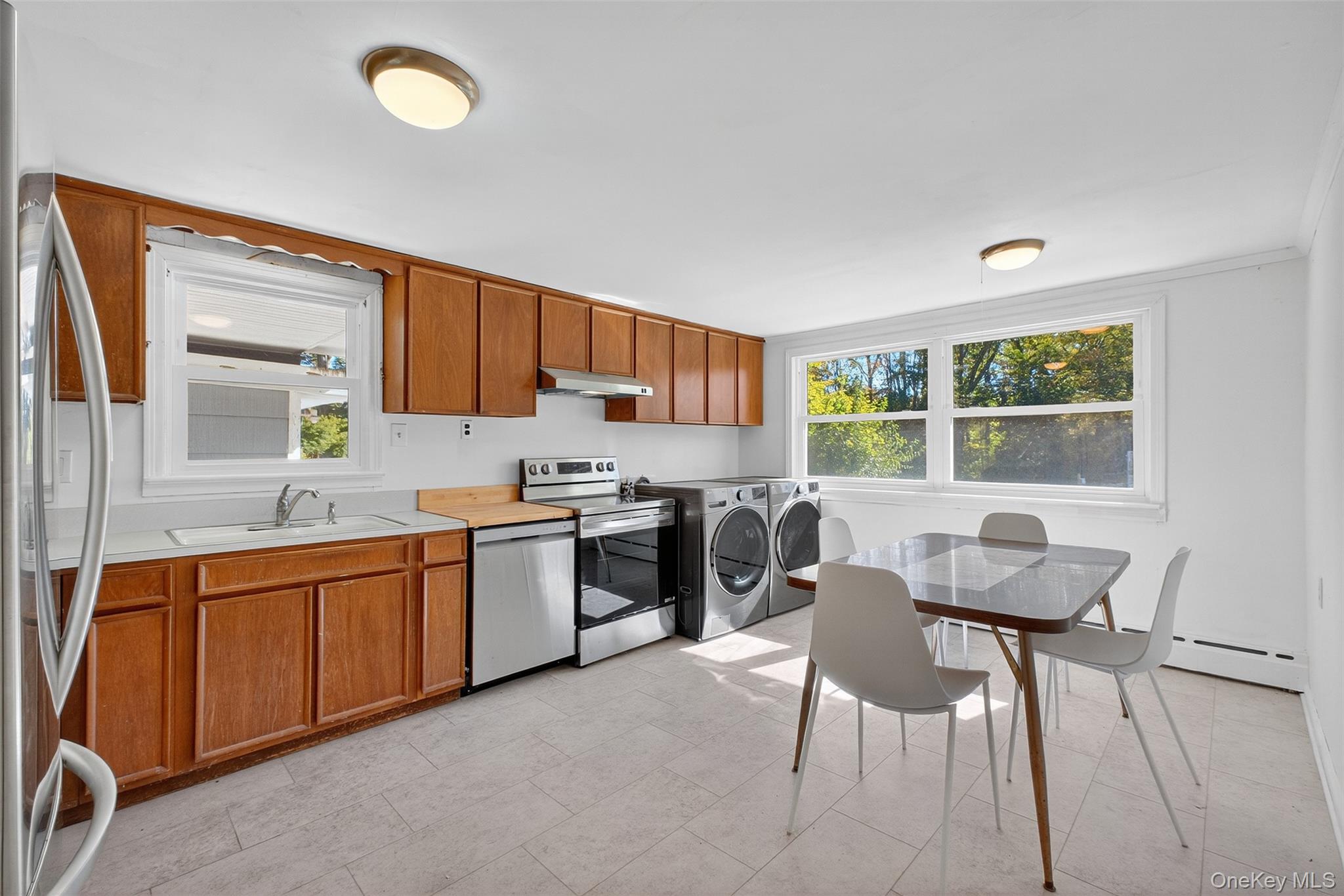 86 Gardnertown Road Newburgh, NY 12550 - Photo 10 of 33 a kitchen with a sink cabinets and window