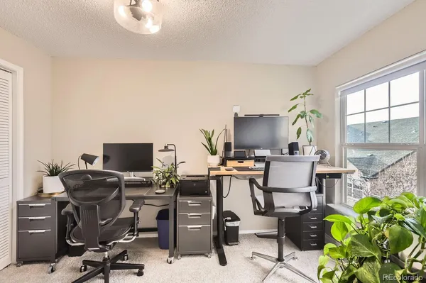 a view of a workspace with furniture