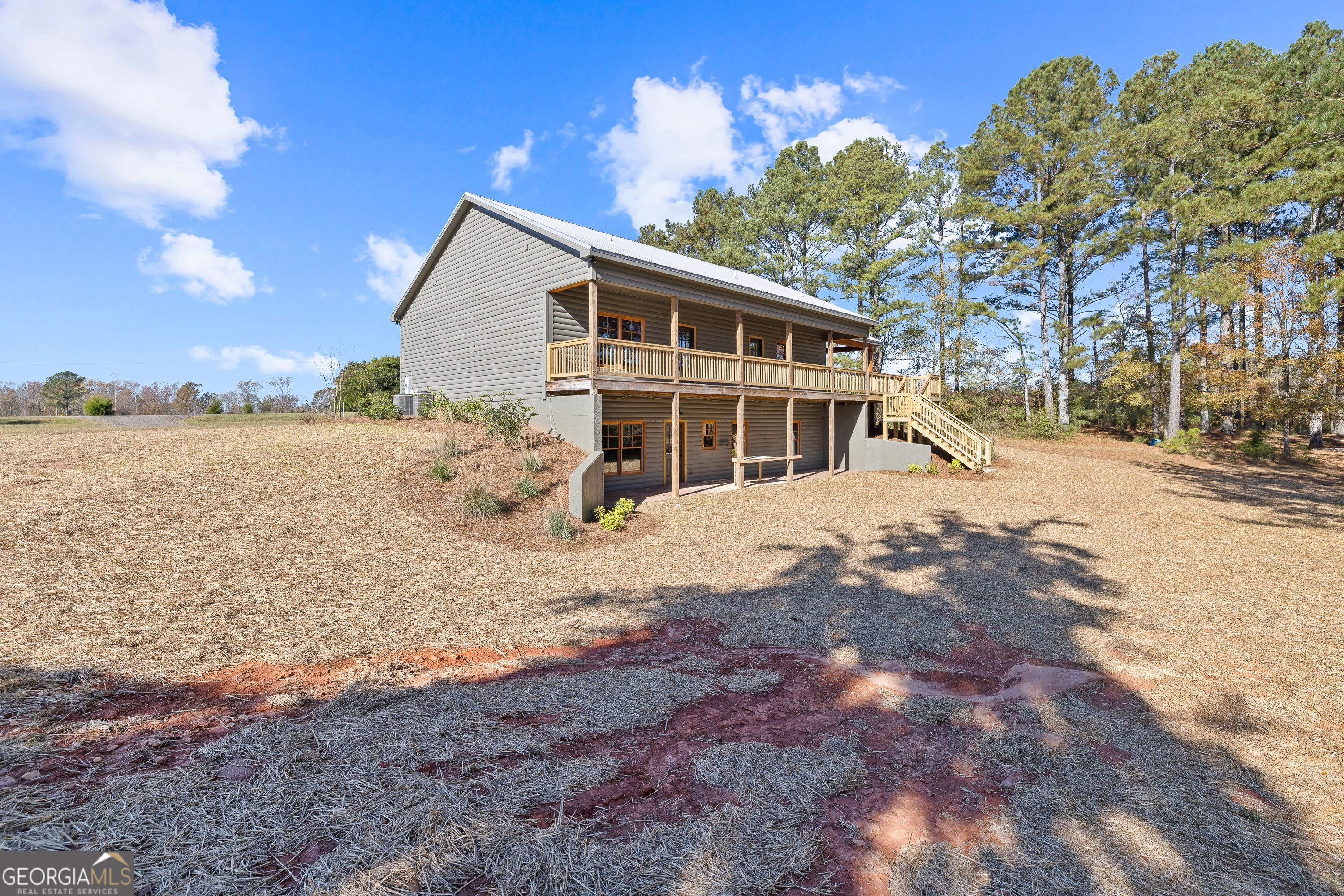 130 North Wesley Chapel Road Eatonton, GA 31024 - Photo 12 of 45 a view of a house with a yard covered in snow