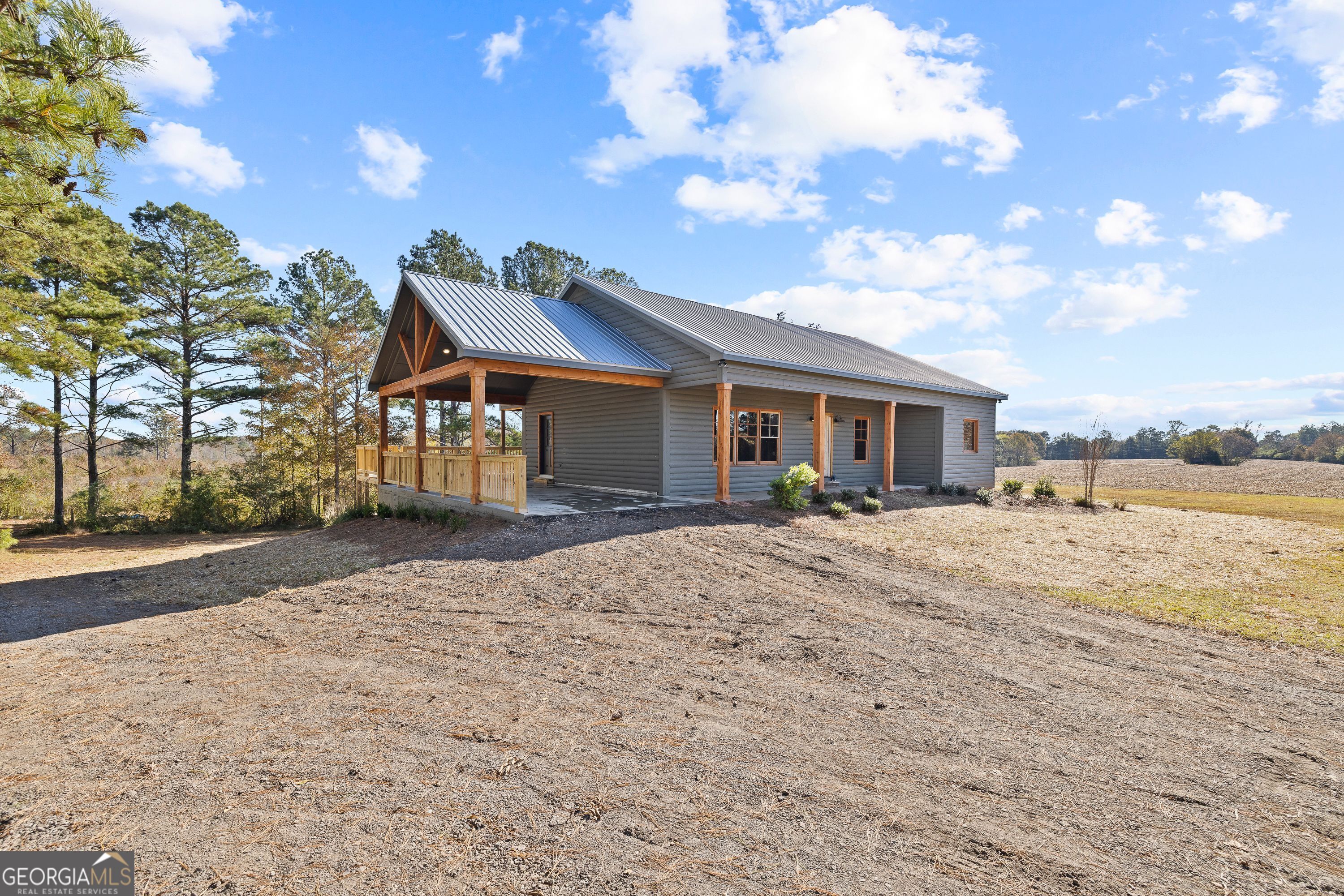 130 North Wesley Chapel Road Eatonton, GA 31024 - Photo 15 of 45 a front view of a house with a yard