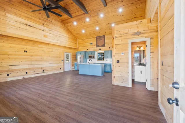 a view of a living room with hardwood floor