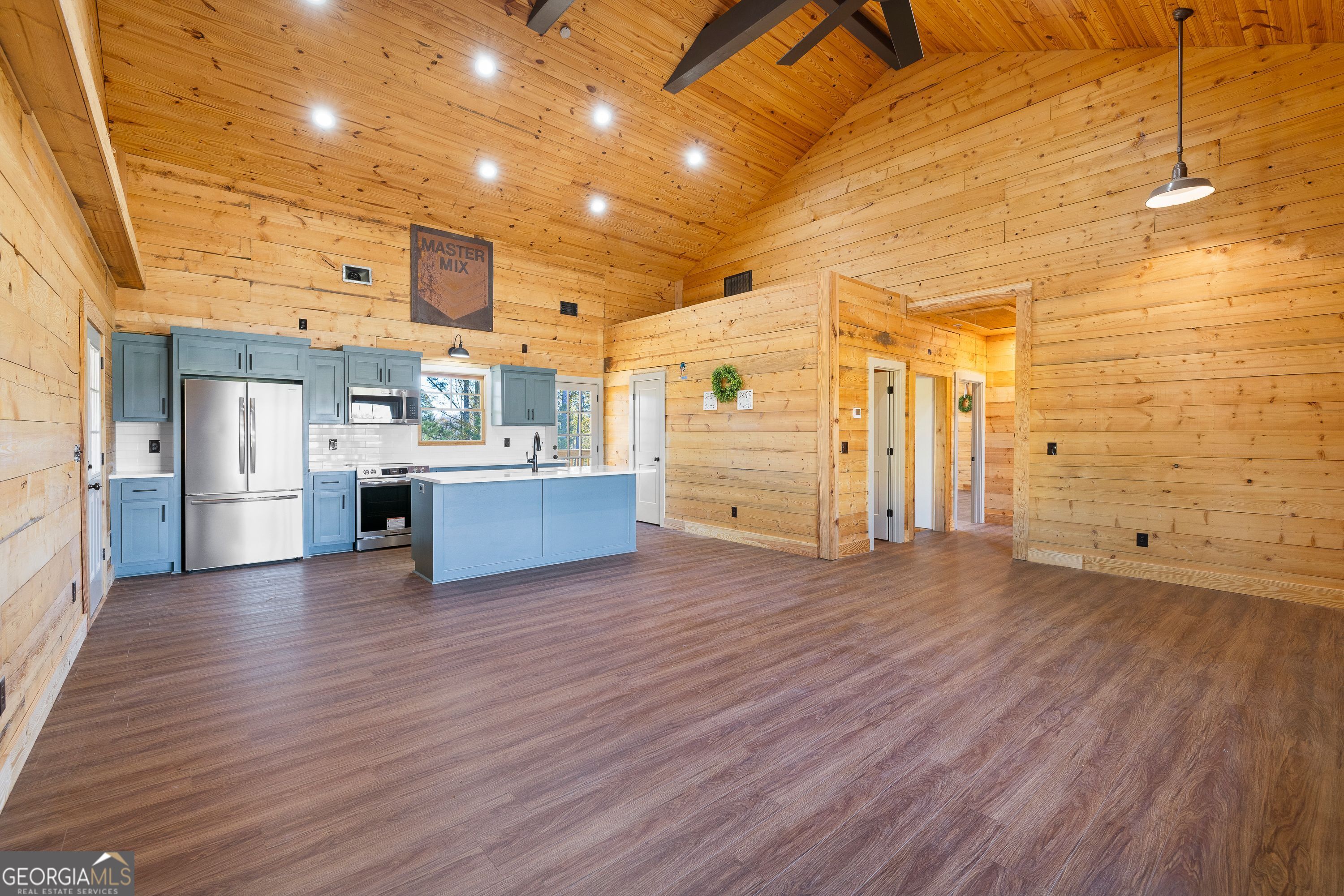 130 North Wesley Chapel Road Eatonton, GA 31024 - Photo 19 of 45 a view of a kitchen with furniture and wooden floor