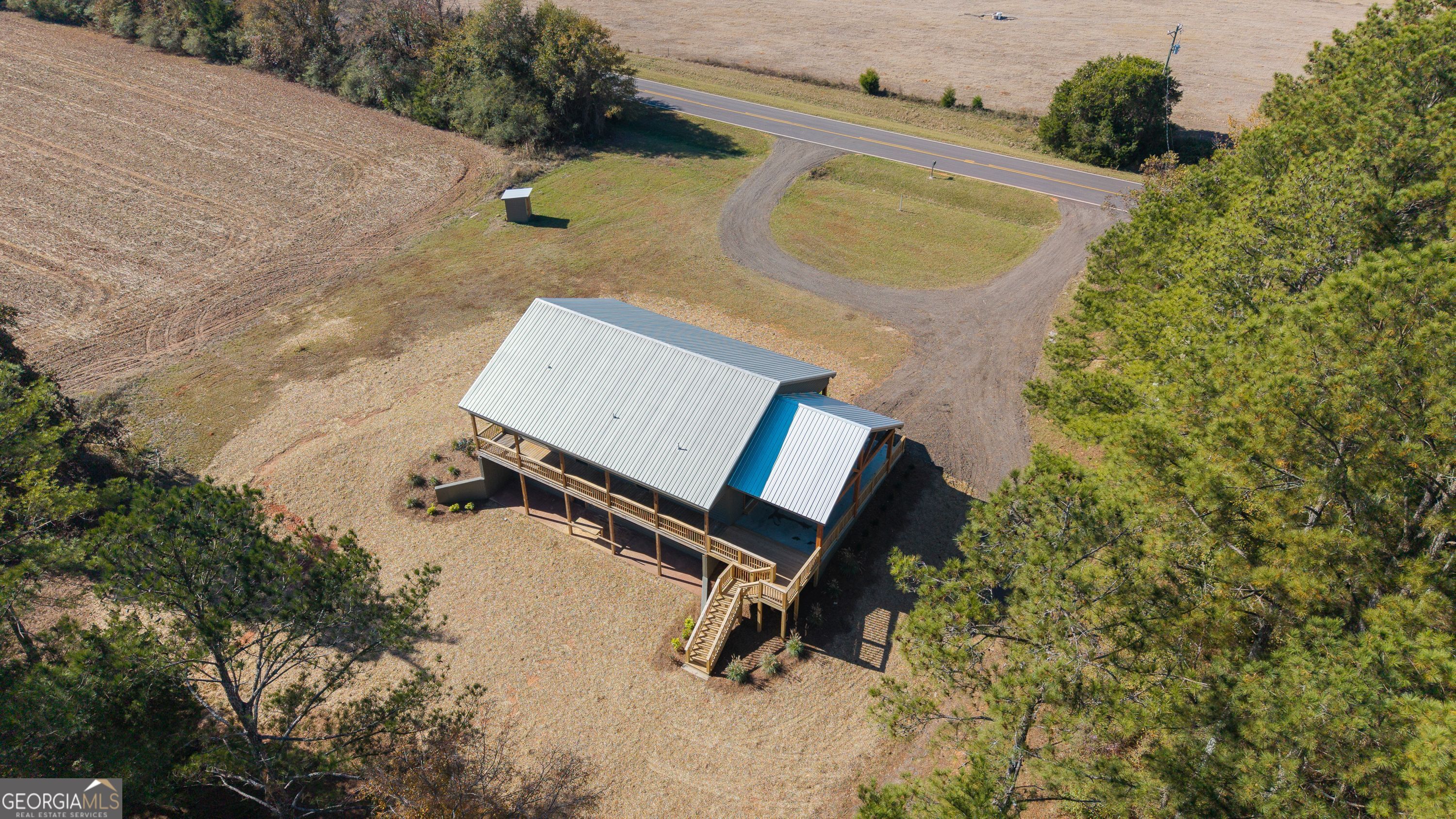 130 North Wesley Chapel Road Eatonton, GA 31024 - Photo 2 of 45 an aerial view of a house with a yard and sitting area