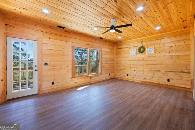 a view of a livingroom with wooden floor
