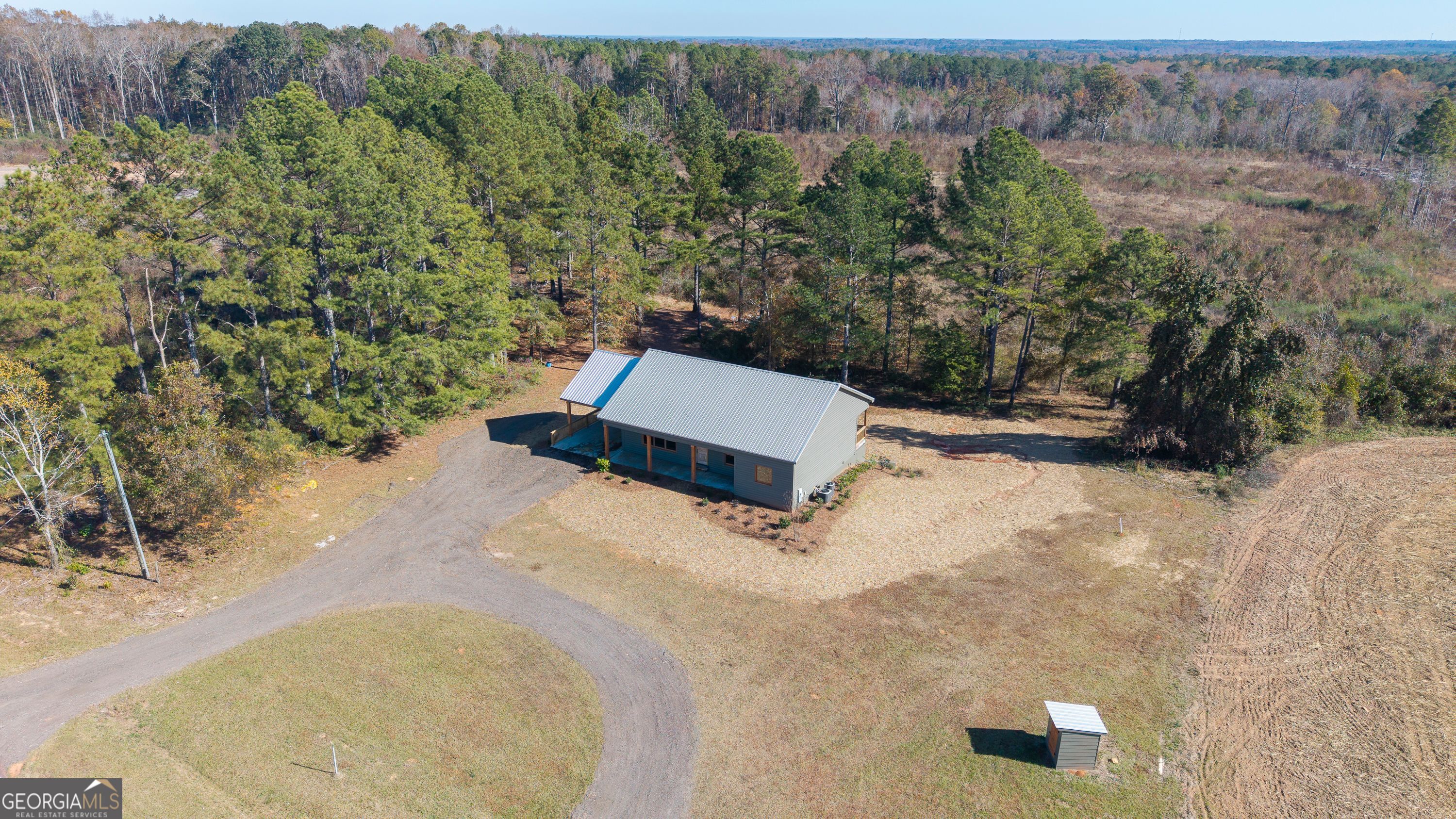 130 North Wesley Chapel Road Eatonton, GA 31024 - Photo 3 of 45 an aerial view of a house with a yard
