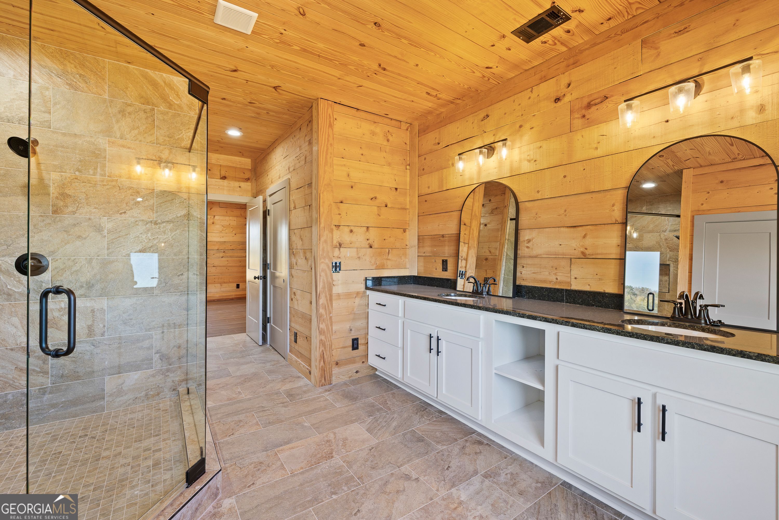 130 North Wesley Chapel Road Eatonton, GA 31024 - Photo 31 of 45 a bathroom with a double vanity sink mirror and shower