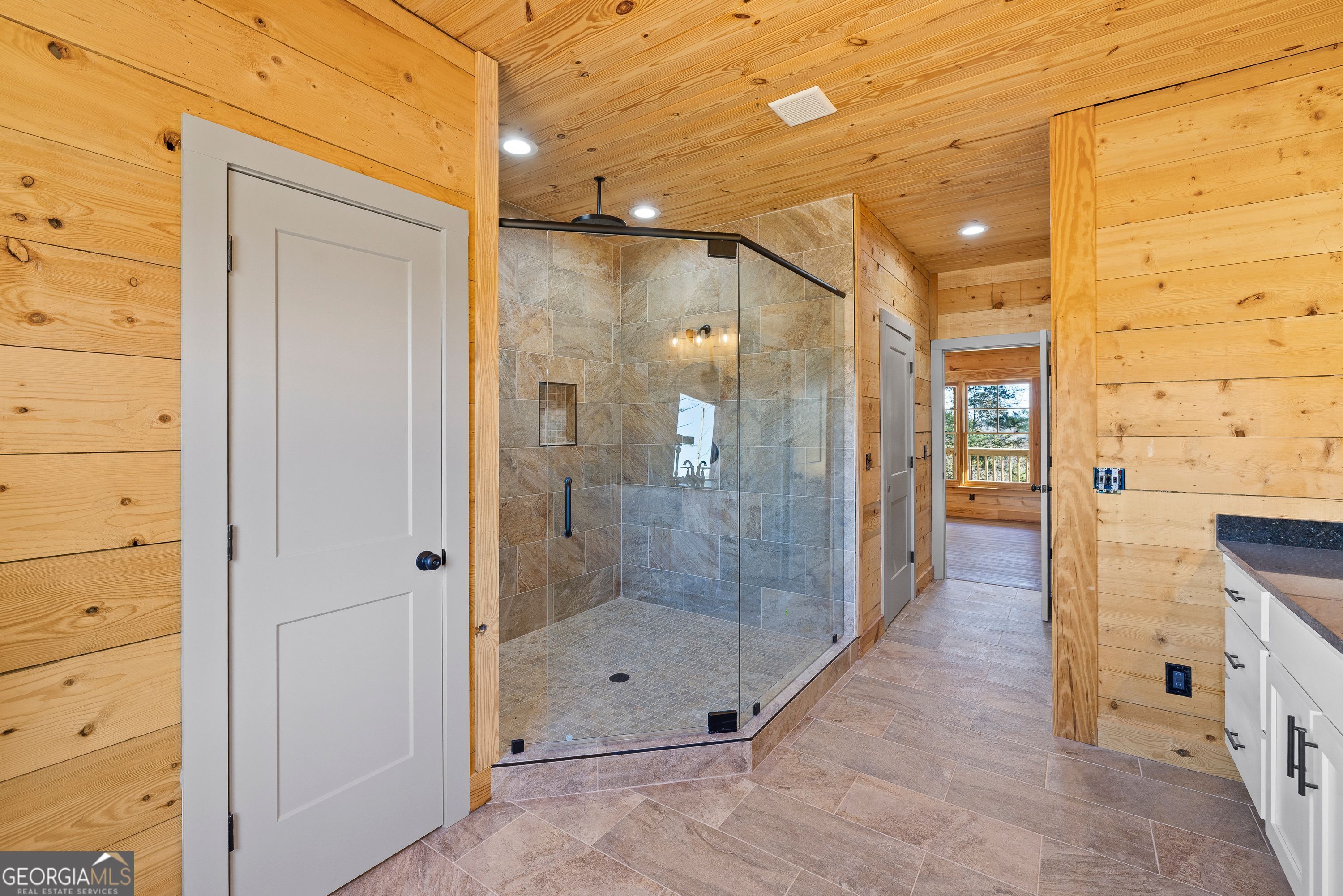 130 North Wesley Chapel Road Eatonton, GA 31024 - Photo 33 of 45 a bathroom with a glass shower door and a sink
