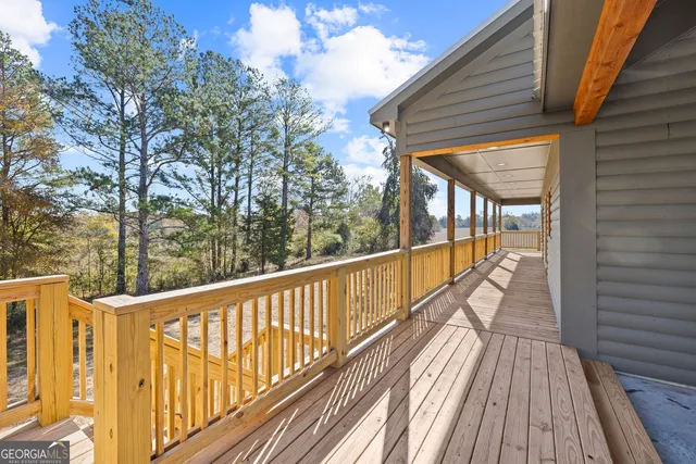 a view of balcony with wooden floor