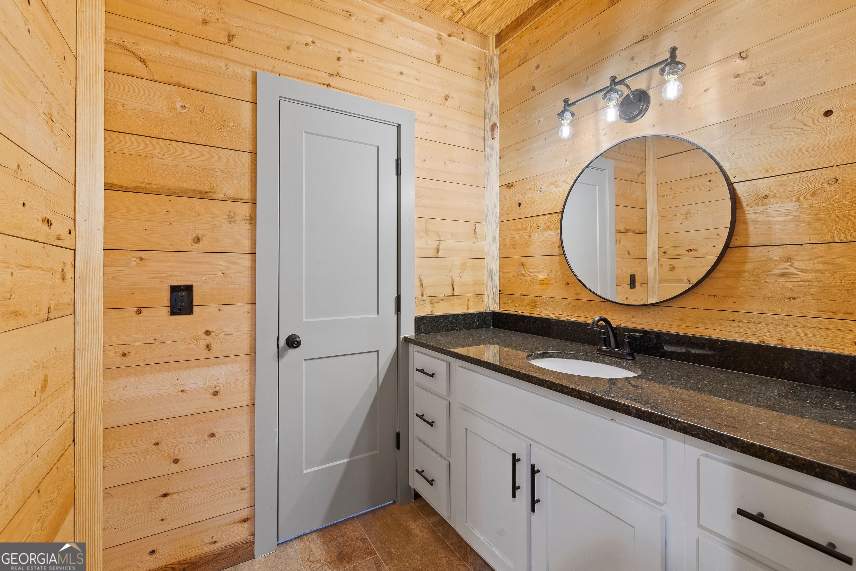 130 North Wesley Chapel Road Eatonton, GA 31024 - Photo 38 of 45 a bathroom with a granite countertop sink and a mirror