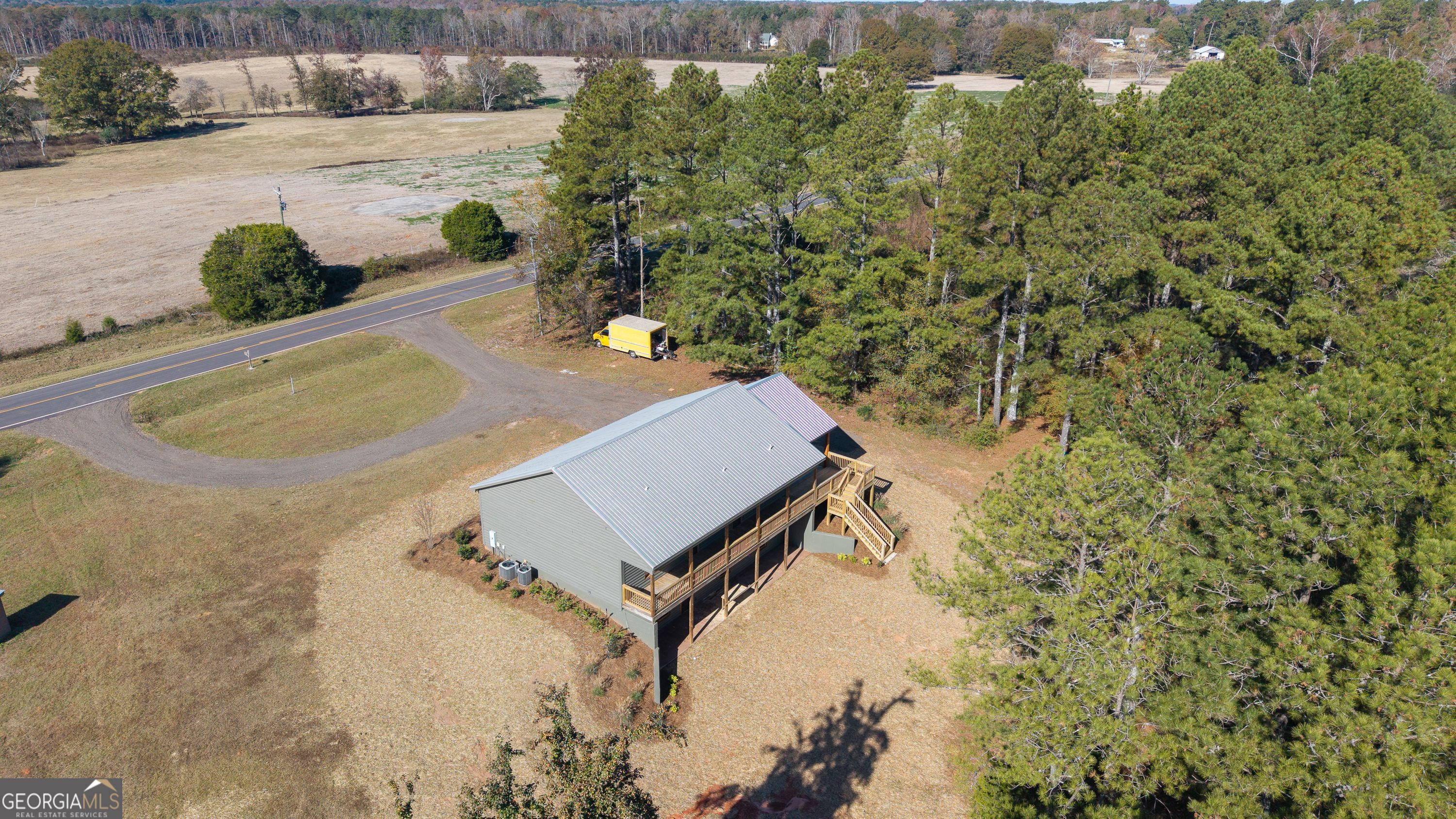 130 North Wesley Chapel Road Eatonton, GA 31024 - Photo 4 of 45 a view of a backyard with plants and outdoor seating