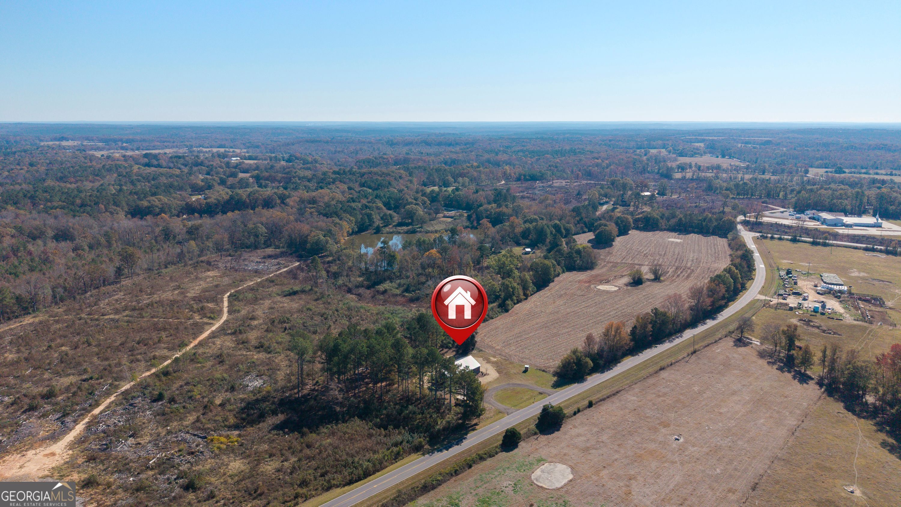 130 North Wesley Chapel Road Eatonton, GA 31024 - Photo 6 of 45 an aerial view of a house with a garden