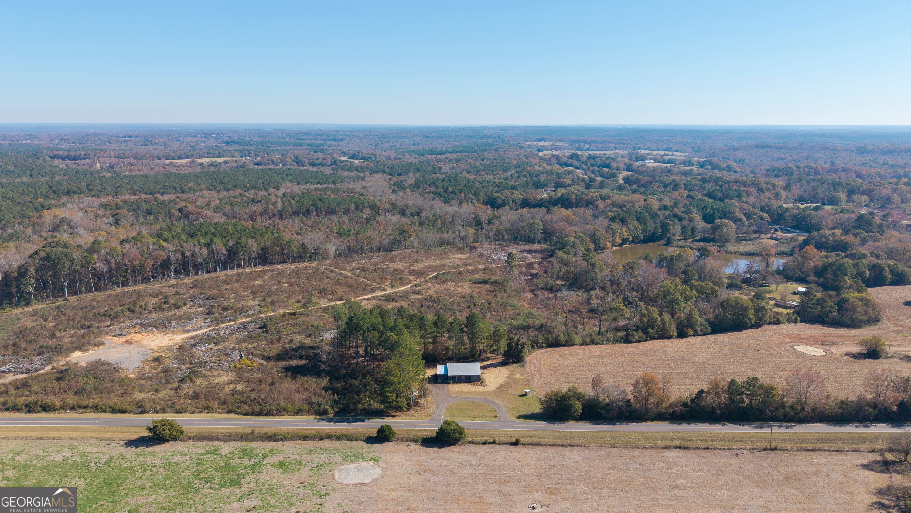 130 North Wesley Chapel Road Eatonton, GA 31024 - Photo 7 of 45 a view of a dry yard with wooden fence