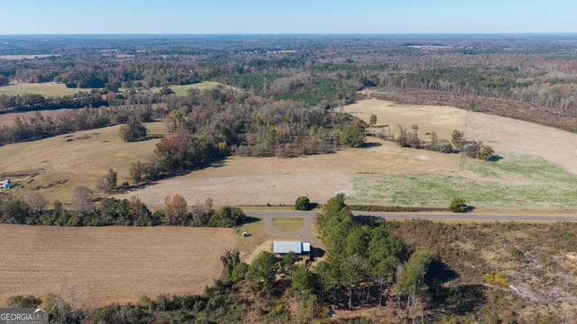 an aerial view of a houses with outdoor space