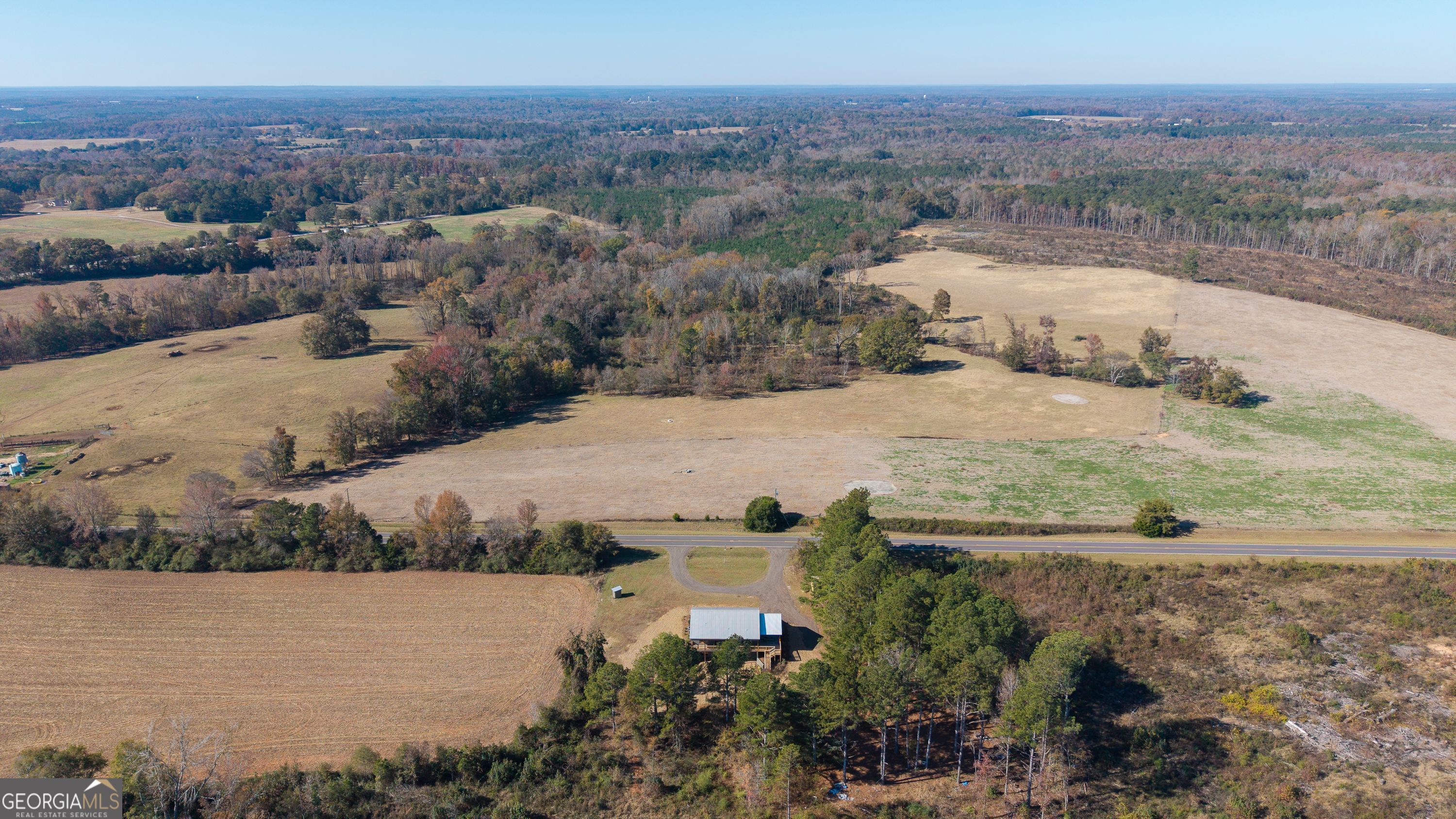130 North Wesley Chapel Road Eatonton, GA 31024 - Photo 9 of 45 an aerial view of a houses with outdoor space